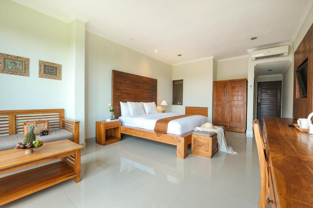 Postel nebo postele na pokoji v ubytování Artini Bisma Ubud Hotel