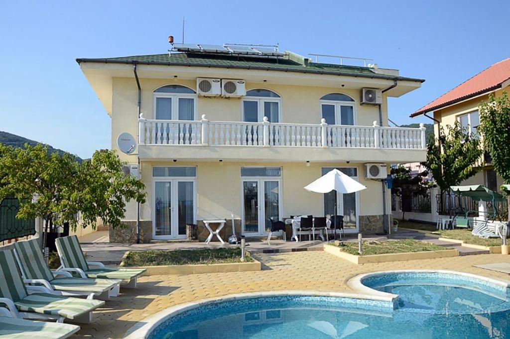 a villa with a swimming pool and a house at Вила Жаклин - Private House Jaklin with Pool in Sveti Vlas