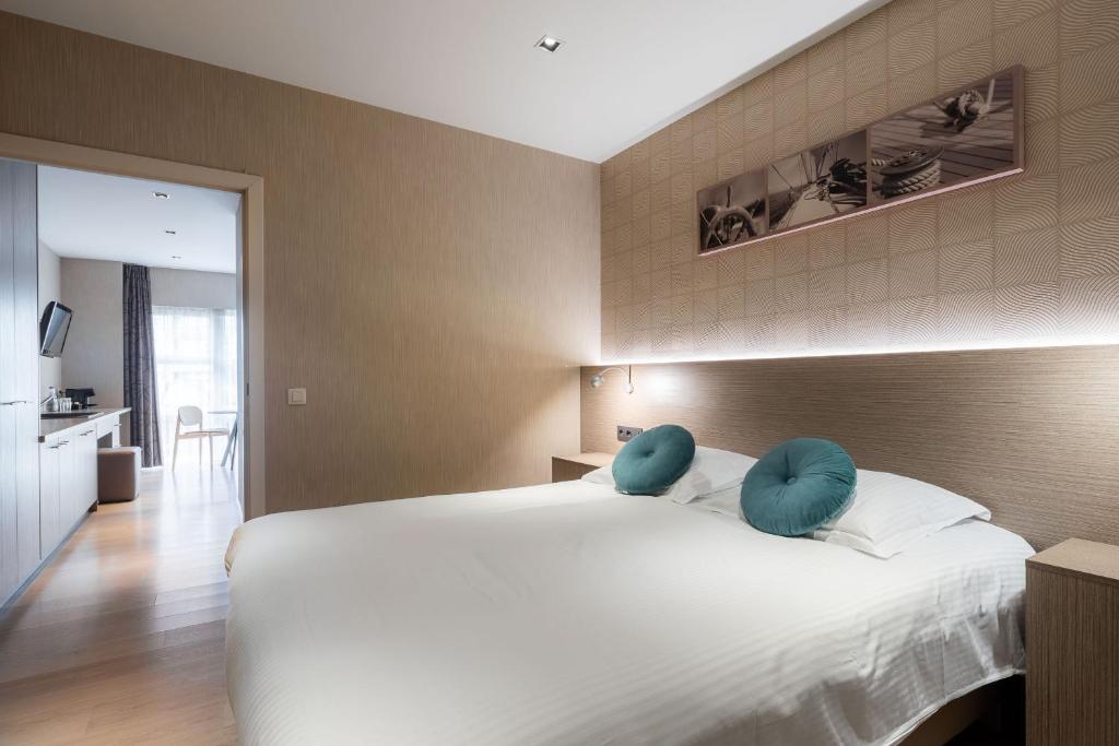 Postel nebo postele na pokoji v ubytování C-Hotels Excelsior
