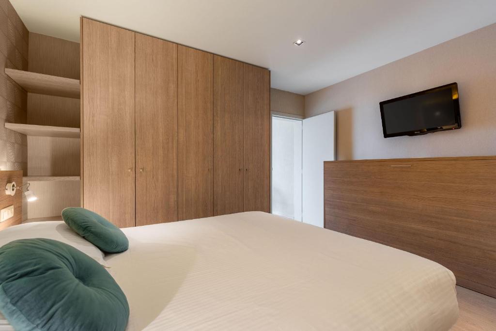 Postel nebo postele na pokoji v ubytování C-Hotels Excelsior