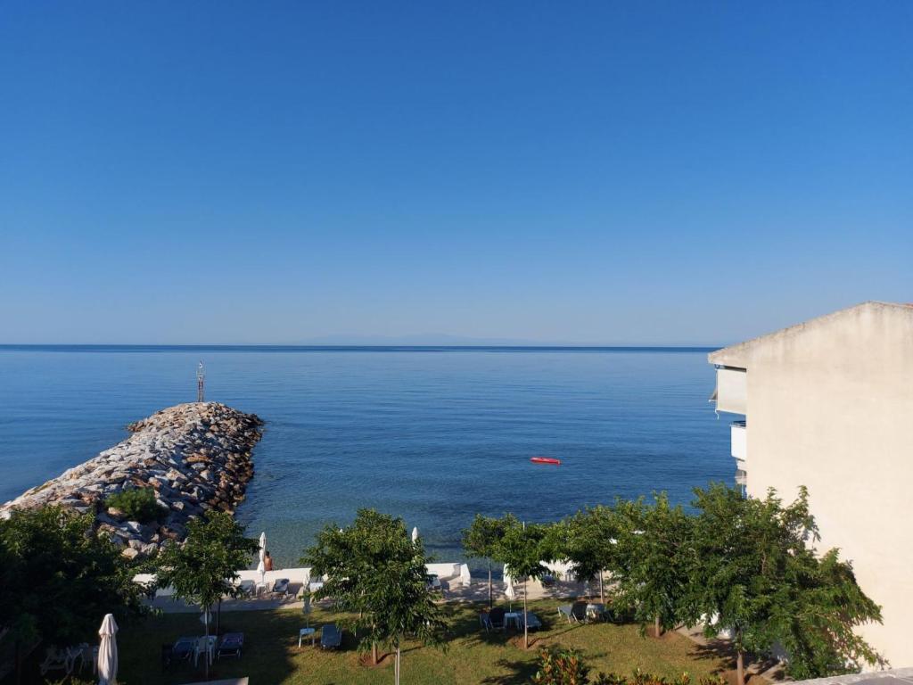 a view of the ocean from a building at PANSION ALEXANDROS BY THE SEA in Nea Skioni