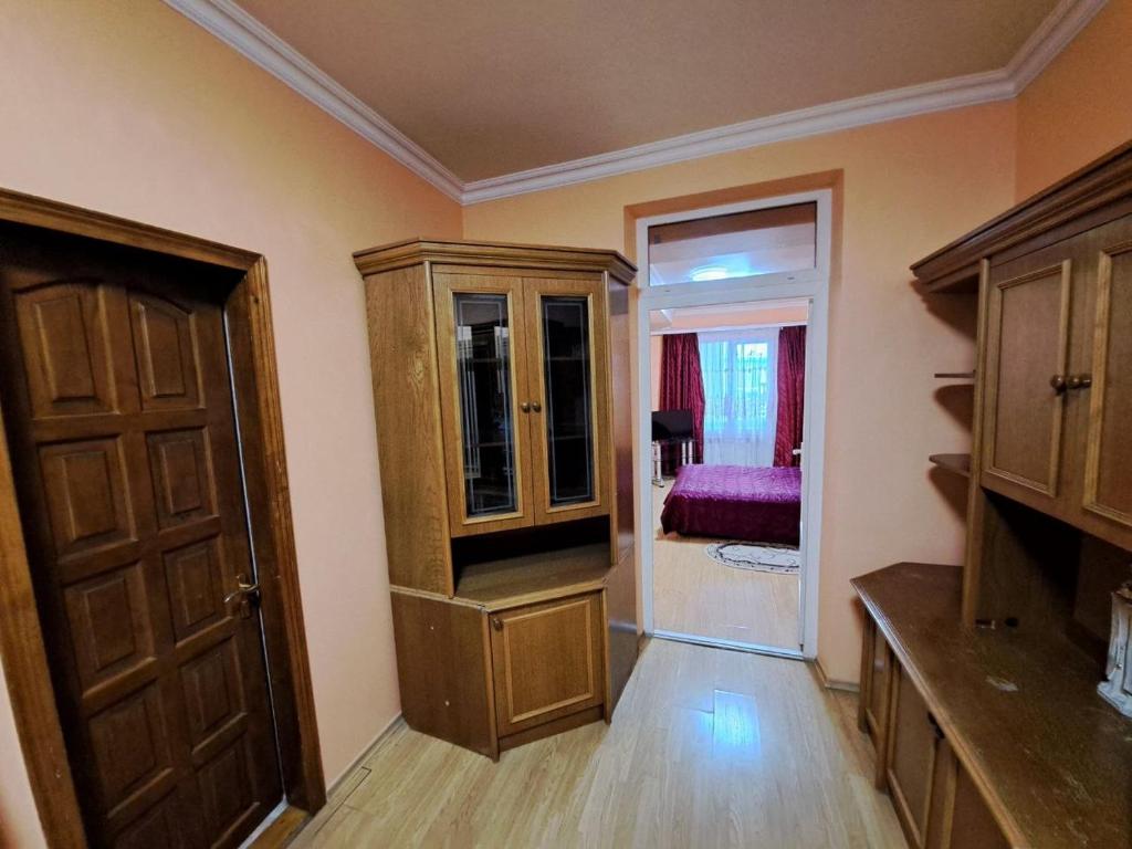 a room with a closet and a door and a bedroom at Zatyshok in Chernivtsi