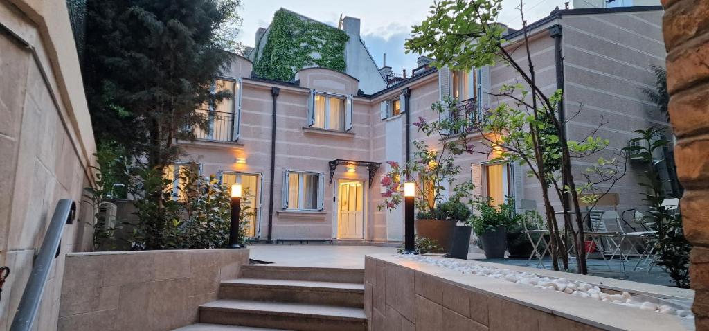 a house with stairs in front of it at Carice Milice Old Town Residence in Belgrade