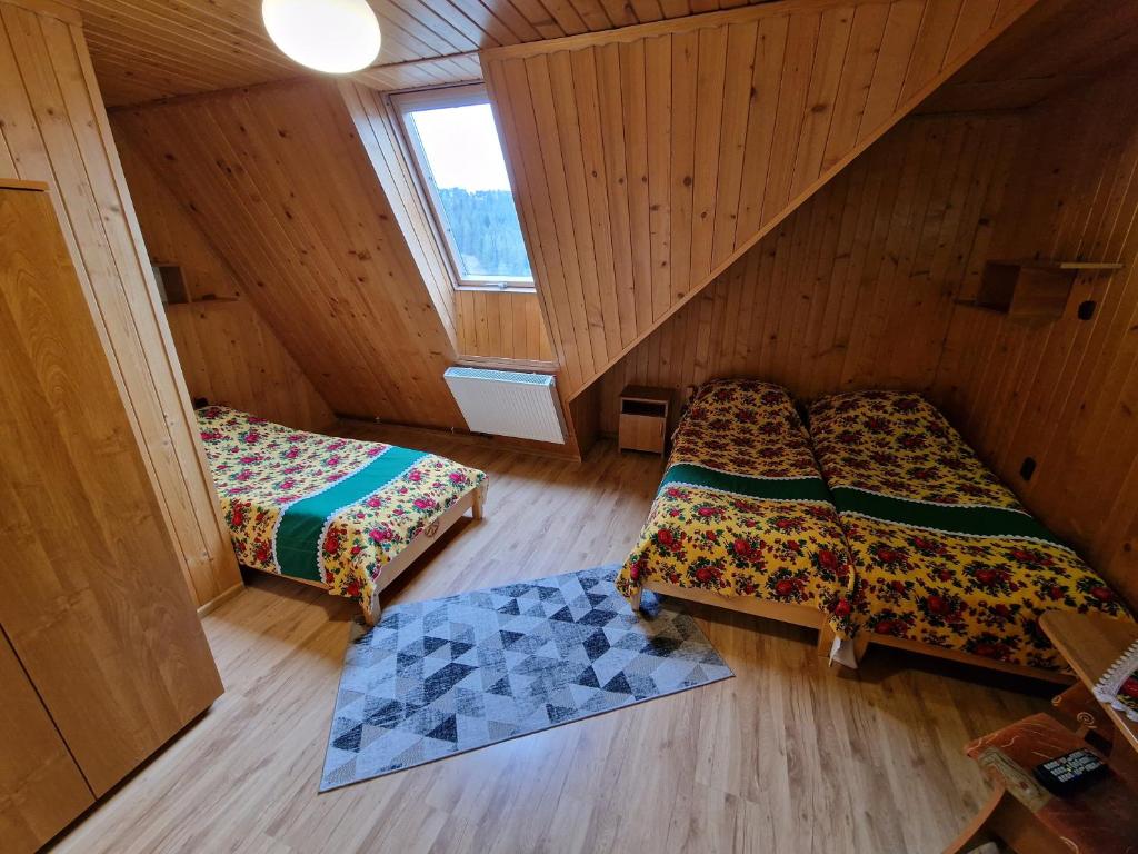 Posteľ alebo postele v izbe v ubytovaní Willa Stachoniówka