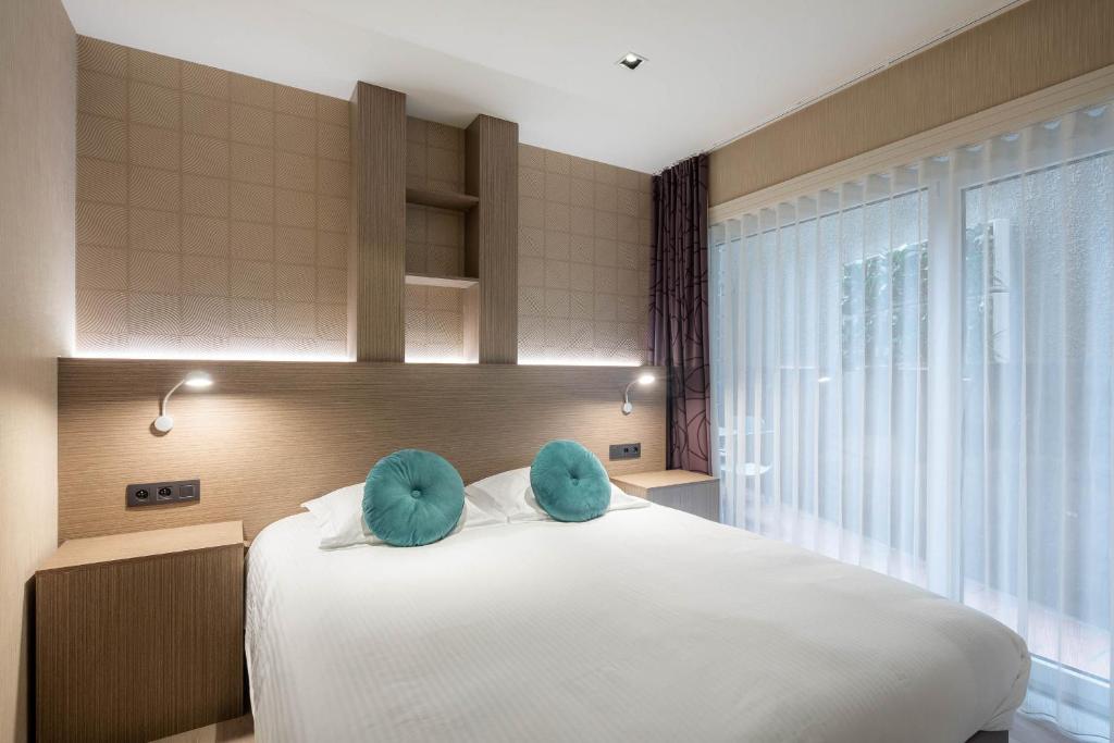 Postel nebo postele na pokoji v ubytování C-Hotels Excelsior