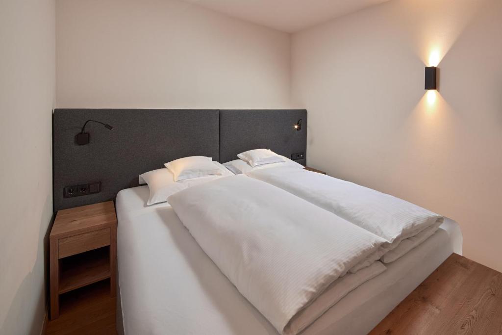 Postel nebo postele na pokoji v ubytování Hotel Sonnblick