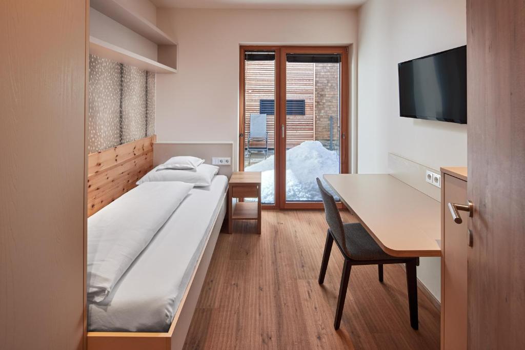 Postel nebo postele na pokoji v ubytování Hotel Sonnblick