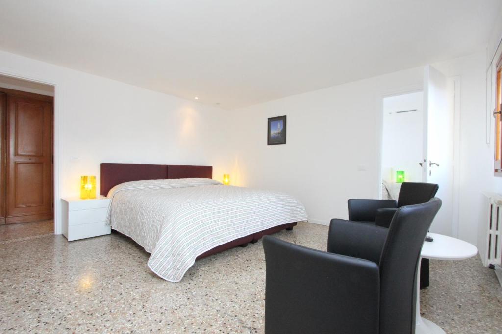 Łóżko lub łóżka w pokoju w obiekcie City Apartments Rialto