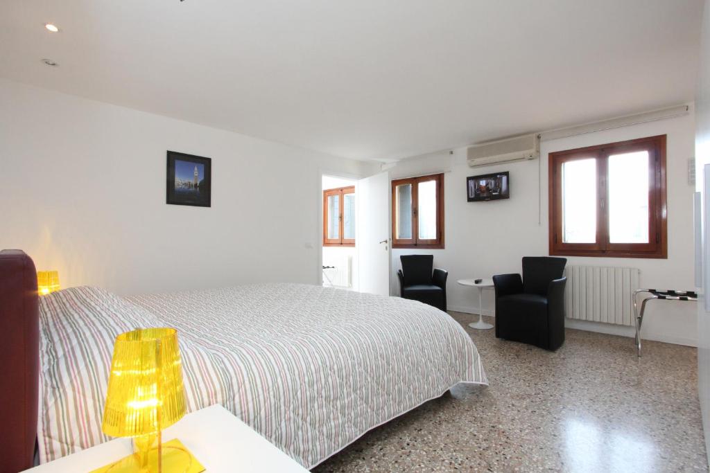 Telewizja i/lub zestaw kina domowego w obiekcie City Apartments Rialto