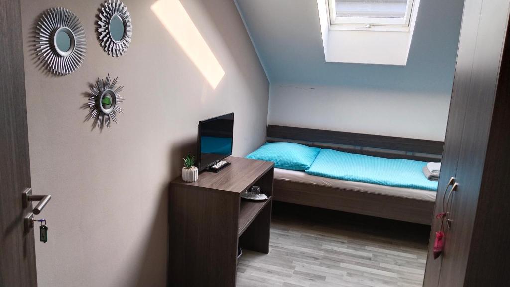 Postel nebo postele na pokoji v ubytování PENZION U BRÁZDŮ