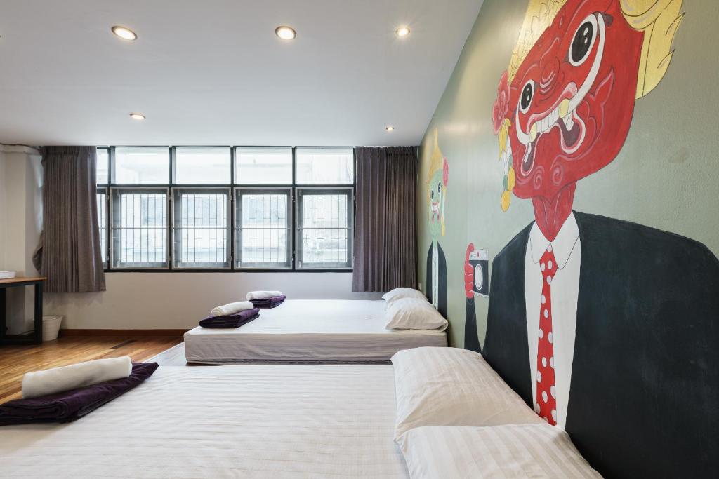 Postel nebo postele na pokoji v ubytování 99 Hostel Khaosan