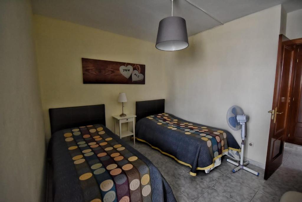 Postel nebo postele na pokoji v ubytování Gran Carihuela