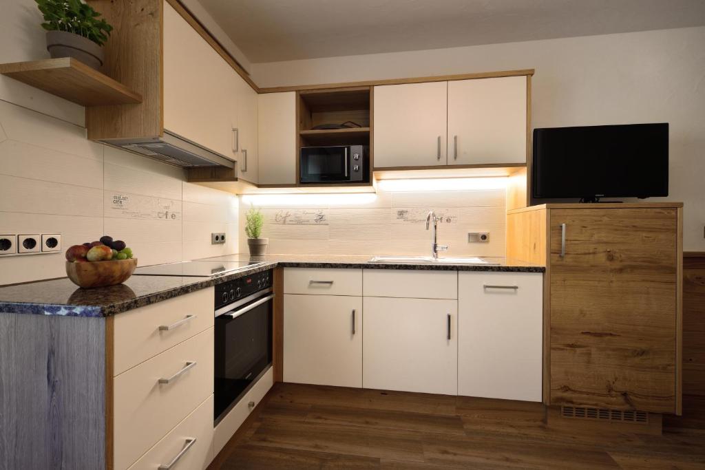 Kuchyň nebo kuchyňský kout v ubytování Aparthotel Garni Monte