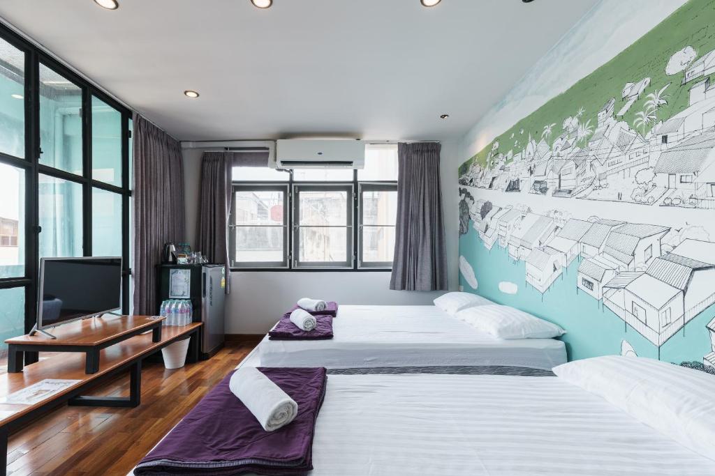 Postel nebo postele na pokoji v ubytování 99 Hostel Khaosan