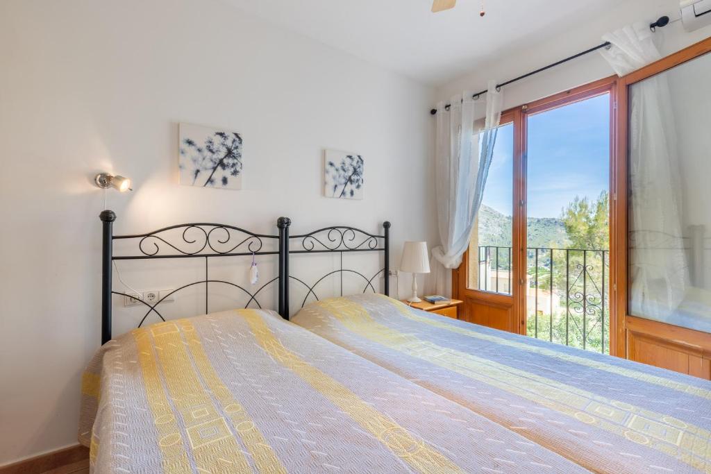A bed or beds in a room at Holiday Villa Near Denia