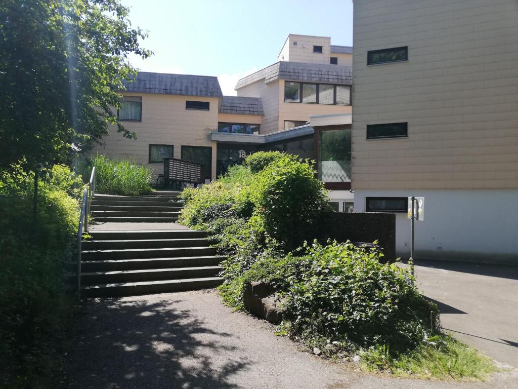 a set of stairs in front of a building at Lived-In Appartement in Bad Urach