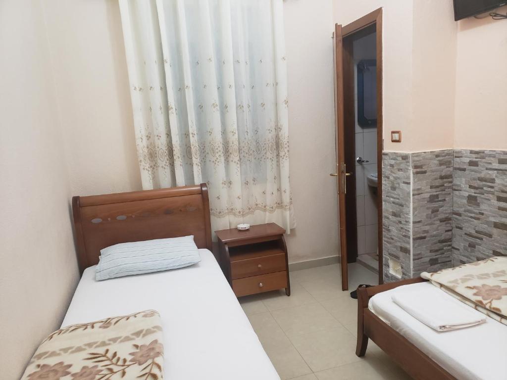 Postel nebo postele na pokoji v ubytování Guest House Kocollari