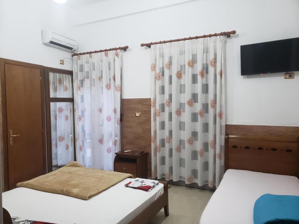 Postel nebo postele na pokoji v ubytování Guest House Kocollari