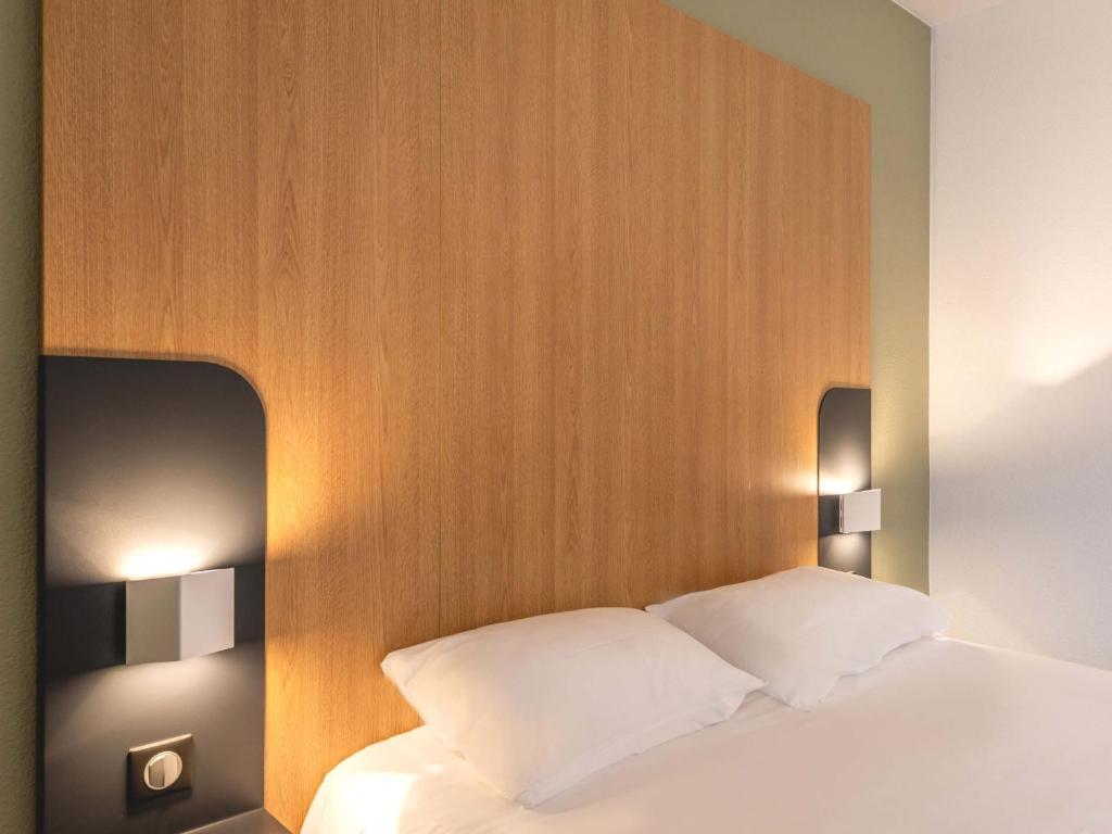 Postel nebo postele na pokoji v ubytování B&B HOTEL Le Tréport Friville
