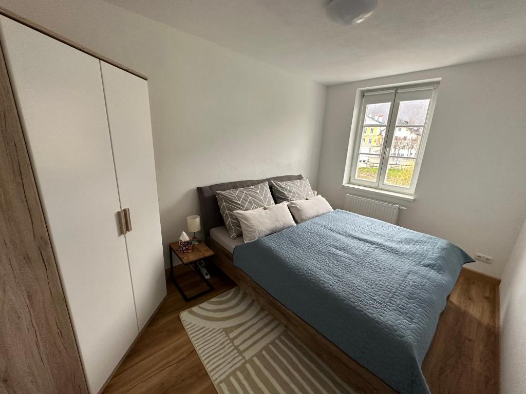 Postel nebo postele na pokoji v ubytování Traunkai Apartments Bad Ischl