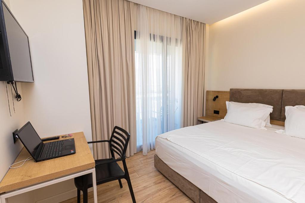 Postel nebo postele na pokoji v ubytování B&B Champagne, Vlore Bay