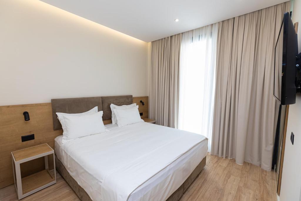 TV a/nebo společenská místnost v ubytování B&B Champagne, Vlore Bay