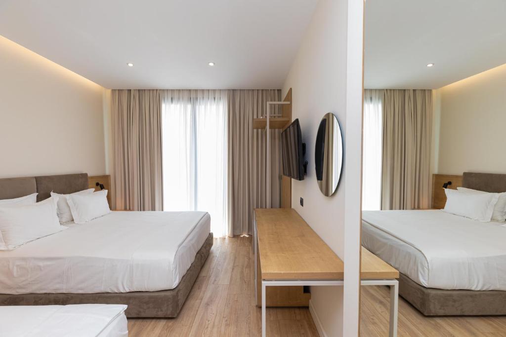 Postel nebo postele na pokoji v ubytování B&B Champagne, Vlore Bay
