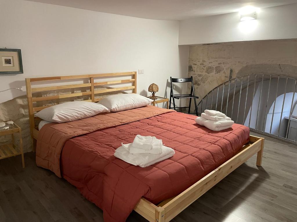Postel nebo postele na pokoji v ubytování ponte vecchio b&b