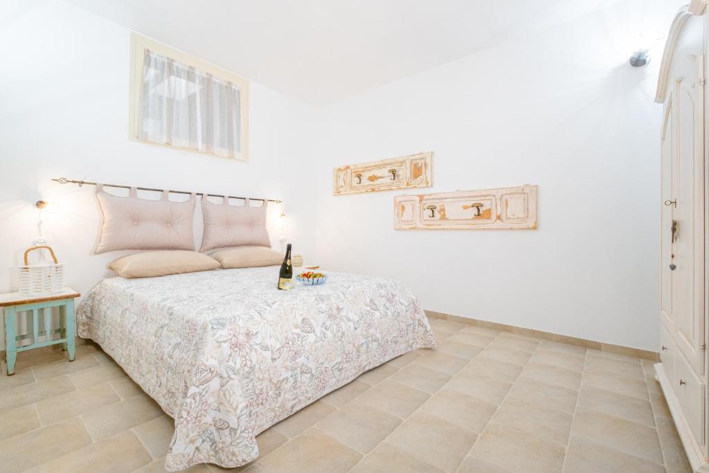 Postel nebo postele na pokoji v ubytování Villa Palamita Luxury - Specchia