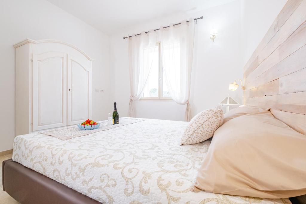 Postel nebo postele na pokoji v ubytování Villa Palamita Luxury - Specchia