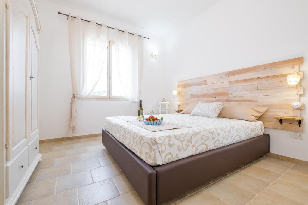 Postel nebo postele na pokoji v ubytování Villa Palamita Luxury - Specchia