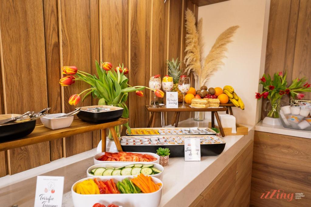 a buffet with fruits and vegetables on a counter at El Doris Boutique Living in Marsaskala