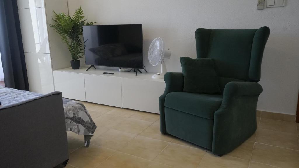 TV a/nebo společenská místnost v ubytování Apartamento Agua Rosa