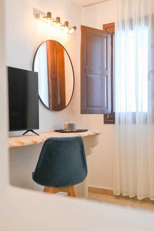TV a/nebo společenská místnost v ubytování Amerisa Suites & Villa