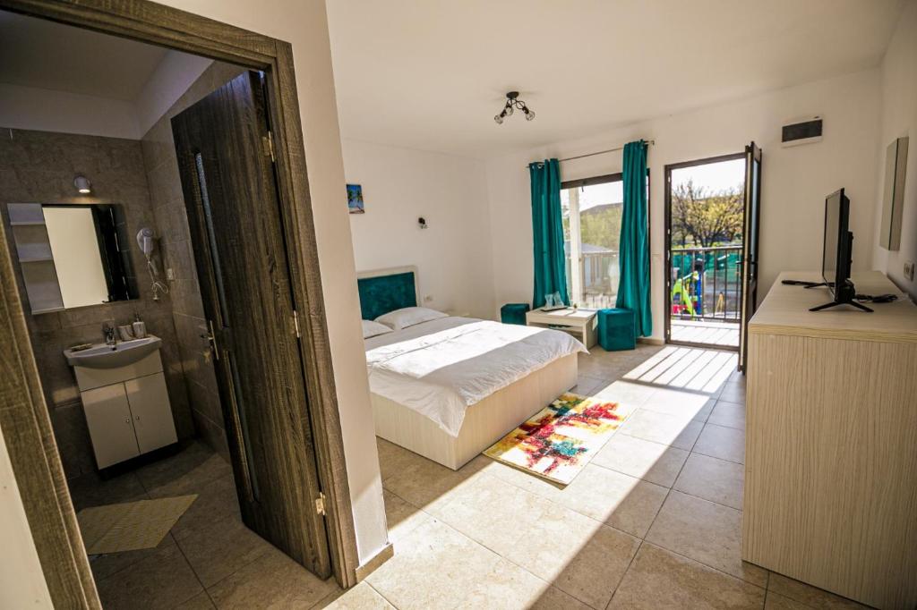 Postel nebo postele na pokoji v ubytování complex turistic N&S