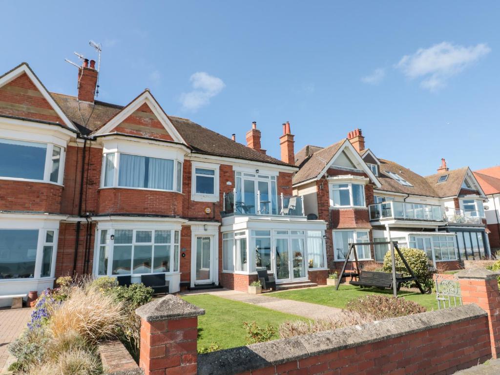 a row of red brick houses with windows at Crystal Cove in Bridlington