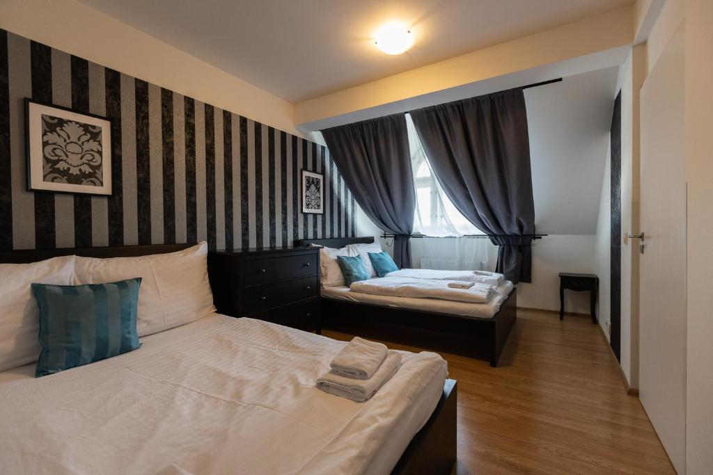 Postel nebo postele na pokoji v ubytování Andel Centre SPIRIT