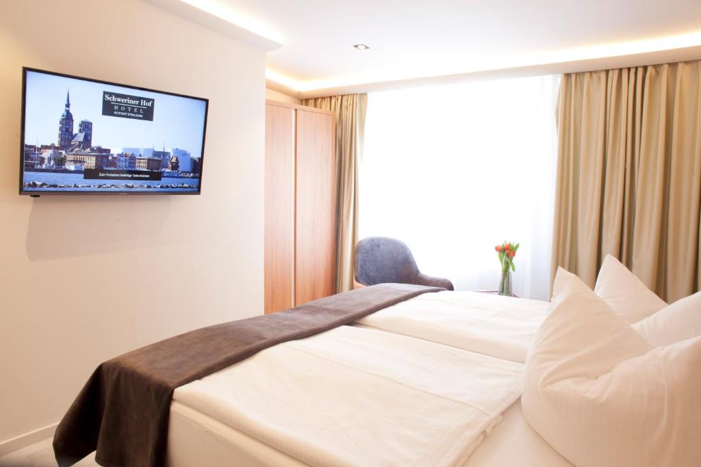 Postel nebo postele na pokoji v ubytování Hotel Schweriner Hof