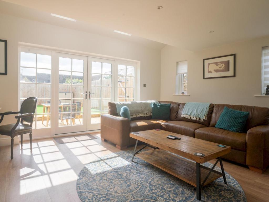 a living room with a couch and a coffee table at Pass the Keys Town Centre cottage with garden and parking in Cheltenham