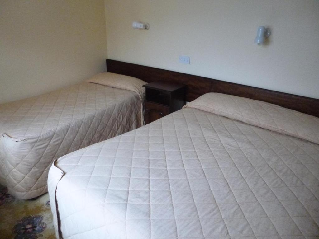 Postel nebo postele na pokoji v ubytování Achill Sound Hotel - Ostan Ghob A'Choire