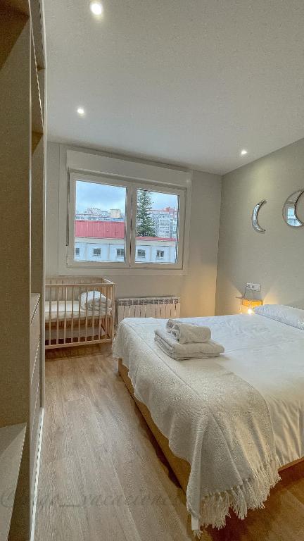 Postel nebo postele na pokoji v ubytování Joaquínloriga24 by Vigovacaciones
