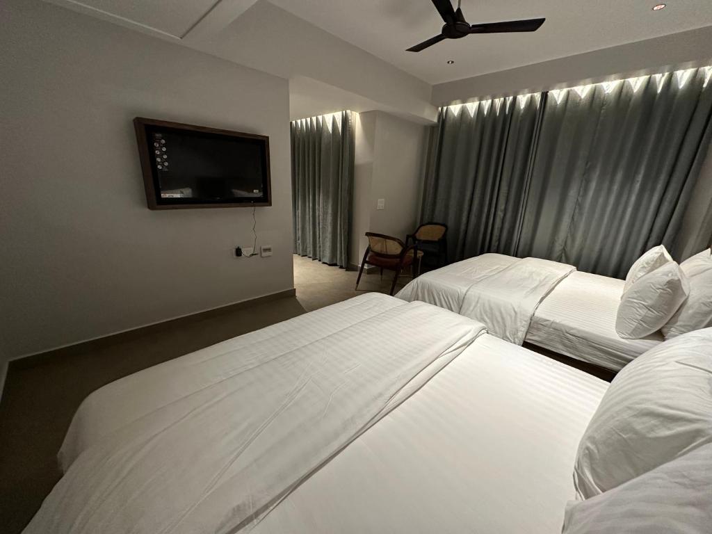 Postel nebo postele na pokoji v ubytování Belvedere Suites