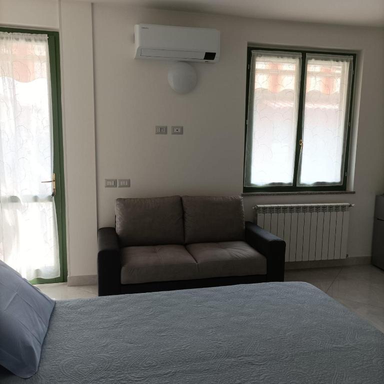 A bed or beds in a room at Fiordaliso B&B