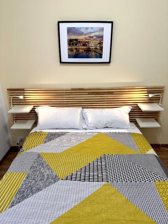 A bed or beds in a room at Rhome Holiday Fornaci