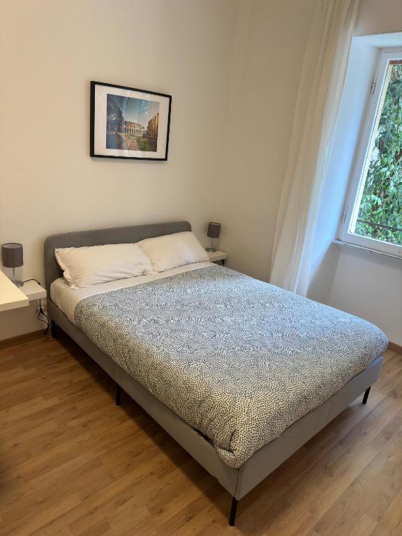 A bed or beds in a room at Rhome Holiday Fornaci