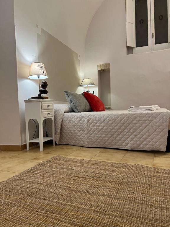 Postel nebo postele na pokoji v ubytování Le Dimore Del Gufo - La Cattedrale