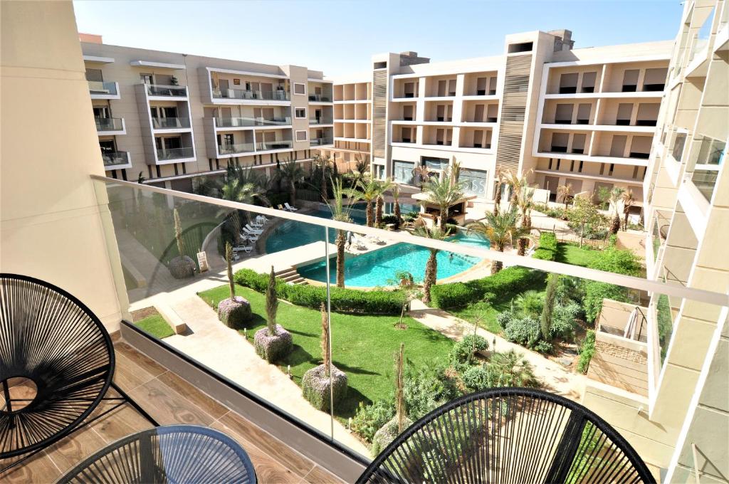 Apartamento con balcón con vistas a la piscina en Royal Deluxe Platinum - Pearl Garden Marrakech, en Marrakech