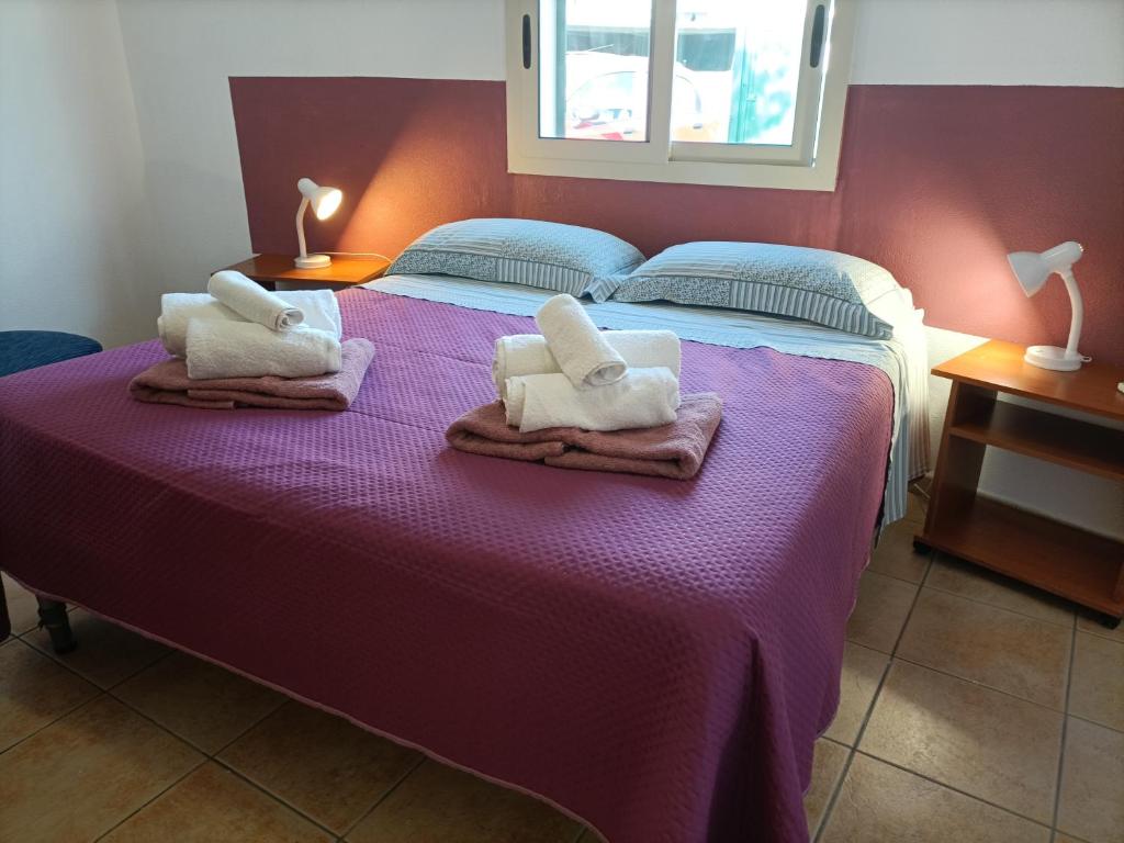 A bed or beds in a room at VILLA TAI