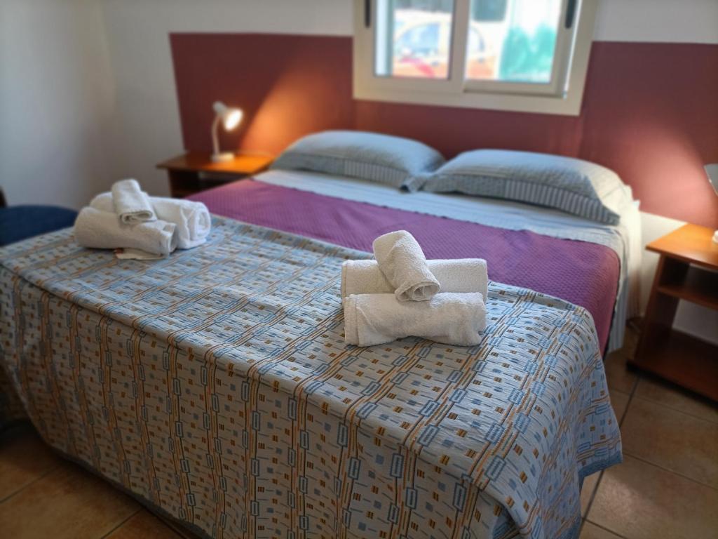 A bed or beds in a room at VILLA TAI
