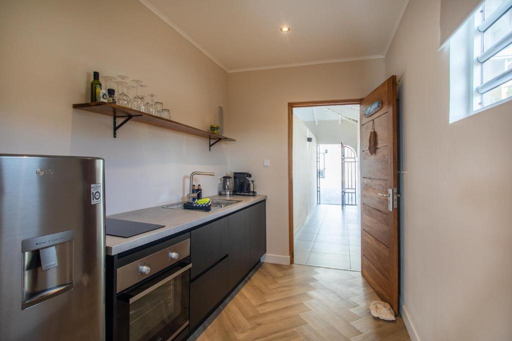 Kuchyň nebo kuchyňský kout v ubytování PUUR! Appartementen Curaçao